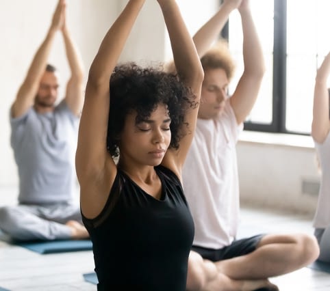 Women and men doing yoga